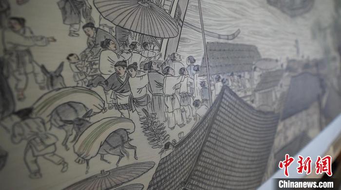 藺烈板刻線畫作品《清明上河圖》局部?！∪诸?攝