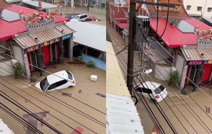 高雄大小區(qū)鹽埕巷于25日被洪水淹沒，街道成汪洋，有民眾的車輛被水沖走